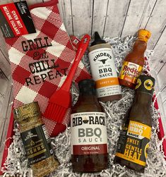 the barbecue gift box includes bbq sauces, seasoning, and other condiments