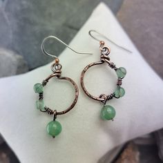 Stunning Green Aventurine Copper Earrings. The perfect addition to your jewelry collection!  Great Energy! These earrings are made with Beautiful Green Aventurine Gemstones, known for their beautiful color and sweet energy!  Featuring a simple yet elegant design, these earrings are carefully hand crafted with copper wire, textured and oxidized to give this unique look! They are lightweight and comfortable to wear all day long. You can effortlessly be stylish and comfortable at the same time. The Handmade Jade Hoop Earrings As Gift, Handmade Hoop Jade Jewelry, Handmade Jade Hoop Jewelry, Green Copper Earrings With Ear Wire, Unique Green Wire Wrapped Earrings, Handmade Jade Hoop Earrings, Adjustable Wire Wrapped Jade Earrings, Unique Copper Wire Drop Earrings, Green Bohemian Copper Wire Earrings