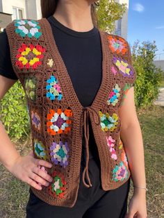 - Crochet Granny Square Festival Vest for Women -  This vest is made with the highest quality material. Indispensable for your combinations with its wonderful colors! Cold weather is approaching this wonderful vest will warm you up. All you have to do is place an order. *It will be made for you only from very soft, hypoallergenic eco-friendly yarn. 🍃 * 55% Organic Cotton - 45 % Premium Acrylic Yarn. 🧵   *If you prefer some special color send me mesage please.   💬  *But don't forget that the tones of colors can be look different on each computer or mobile. ❗ *Length: 17.7"(47cm.) *Model's Size: heigth 170 weigth 57 📏 *If you need special size, please write your chest, hip and sleeve measurements and choose size according to you highest measurement.    *INSTRUCTIONS: Hand wash 36F/30C an Granny Square Waistcoat, Crochet Granny Square Vest, Crochet Gilet, Granny Square Vest, Festival Vest, Crochet Waistcoat, Vest For Women, Crochet Granny Square, Vest Outfits