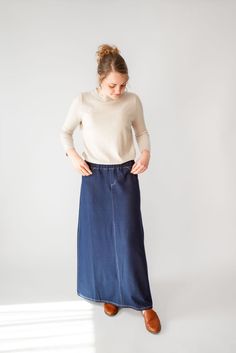 With the look of real denim but the feel of soft knit, comfort is the key element in our Caroline skirt. The quick, effortless pull-on style makes this skirt an effortless option for every day. Larger waist-size? The elastic waistband gives stretch without feeling bulky. A skirt like this will take you through the day, from grocery shopping to making dinner, or even a quick coffee shop visit for a chat with a friend over lattes! This skirt has become a best-seller. Style: elastic waist, soft knit fabric, functioning back pockets Color: navy denim Fabric content: 65% Cotton, 30% Polyester, 5% Spandex Care instructions: wash gentle cycle, cold; lay flat to dry, cool iron if needed. Our sizing is always approximate and can also vary due to personal preference and body shape. Please allow a 1" Making Dinner, Quick Coffee, Be Intentional, Knit Maxi Skirt, Modest Clothing, Long Knit, Curated Gifts, Grocery Shop, Grocery Shopping