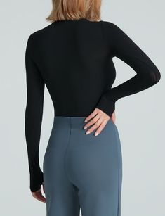 Made from a matte-black, seamless microfiber with endless stretch, our Ballet Turtleneck Long Sleeve Top features thumbhole details and bonded edges for a sleek finish. Will be on high rotation. Product Details    Luxury microfiber blend (84% nylon, 16% elastane)   Fit-tested by real women  One size fits most  Four-way stretch and high recovery  High fabric breathability  Snap closure gusset   Machine washable   Item KT071 Nylon Activewear With Thumbholes, Solid Nylon Activewear With Thumbholes, Solid Activewear With Thumbholes And 4-way Stretch, Solid Activewear With Thumbholes In Elastane, Micro-elastic Solid Tops For Workout, Stretch Activewear With Thumbholes, Versatile Activewear With Thumbholes, Versatile Solid Activewear With Thumbholes, Micro-elastic Elastane Tops With Moisture-wicking