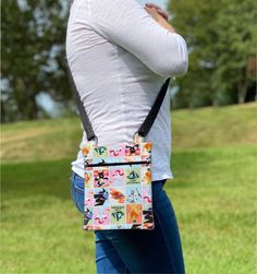 Wizard of Oz  crossbody bag is perfect for someone always on the go whether you are running errands or enjoying vacation, with plenty of room for your phone, keys, wallet, and sunglasses. If you need to carry a lot or just a few things - this is the bag for you! It has two interior pockets to keep your items organized and a large back pocket so your phone is within easy reach or you can bring a book to the coffee shop. The adjustable strap allows for a comfortable fit for all. You can also clip your keys, water bottle, or doggy bag holder onto the D rings for increased functionality. - zipper closure - zipper colors may vary - two interior pockets - interior pocket fabric may vary - one large back pocket - adjustable strap for comfortable fit with a maximum wearable length of 54 inches - a Casual Travel Phone Bag With Zipper Pouch, Wizard Oz, Quilted Bags, Bag Holder, Quilted Bag, All You Can, Wizard Of Oz, The Coffee, Book Lover