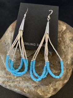 * Beautifully Handmade and original these Blue Turquoise Dangle Liquid Silver Heishi Earrings can add a look of elegance with any casual attire. * They are in Sterling Silver. * Length 2" * Free Gift Pouch with Purchase * Made in USA Please contact seller for any questions and concerns. We hope you have a great experience with us and hope for an awesome review. Southwestern Blue Earrings For Pierced Ears, Southwestern Style Blue Earrings For Pierced Ears, Southwestern Style Blue Pierced Earrings, Nickel-free Blue Southwestern Earrings, Turquoise Drop Chandelier Earrings With Ear Wire, Blue Teardrop Sterling Silver Chandelier Earrings, Blue Nickel-free Long Drop Teardrop Earrings, Turquoise Chandelier Drop Earrings, Southwestern Blue Drop Earrings