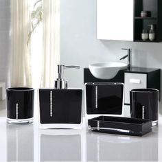 black bathroom accessories set on white countertop in modern style home decor with sink and mirror