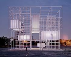 a large metal structure sitting in the middle of a parking lot