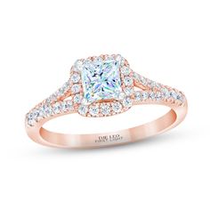 a rose gold engagement ring with a princess cut diamond in the center and pave set diamonds around the band