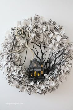 a paper wreath with a house on it