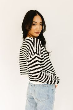 it’s a tank, it’s a cardigan – it’s a tank + cardigan combo. detailed with a retro-inspired black + white stripe pattern, this cropped sweater tank + cardigan set is a spring outfit staple. wear them together or separately to elevate any outfit. black + white // two piece set, scoop neckline, buttons, drop shoulder paired with our sicily distressed denim model is 5'8" + wearing a small measurements are approximate + taken while laying flat small : bust 44” length 18.5” tank: small : bust 28” len Trendy Spring Crop Top Sweater, Chic Knit Cropped Sweater For Spring, Trendy Crop Top Sweater For Spring, Trendy Relaxed Fit Cropped Sweater For Spring, Spring Cropped Sweater For Day Out, Spring Day Out Cropped Sweater, Chic Striped Cardigan For Spring, Knit Crop Top Sweater For Spring, Striped Cropped Sweater For Spring