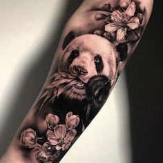 a panda bear with flowers on his arm