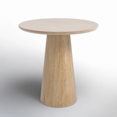 a round wooden table sitting on top of a white floor