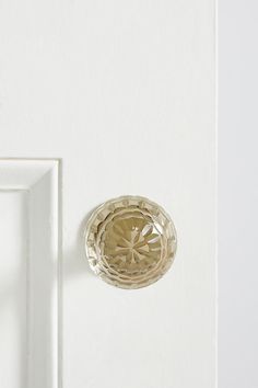 a white door with a glass knob on it