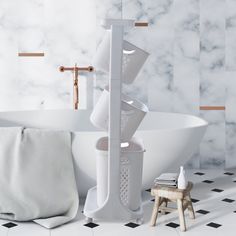 a bathroom with marble walls and flooring, including a white bathtub filled with cups