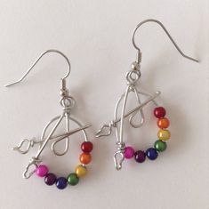 These earrings are a great gift for artists and art teachers. Beads are called Miracle Beads. Wire is non-tarnish aluminum. Surgical steel earring hooks are hypo-allergenic. I have been making custom wire art and jewelry for 30 years. I started in 1989 selling jewelry on the streets of Montreal. Over the years I have participated in many craft shows, exhibitions and sold my work in gallery shops across Canada including the National Gallery of Canada. My husband and I specialize in custom wedding Adjustable Artsy Nickel-free Hoop Earrings, Adjustable Rainbow Sterling Silver Earrings, Artsy Nickel-free Dangle Hoop Earrings, Artsy Wire Wrapped Earrings Gift, Multicolor Wire-wrapped Beaded Earrings For Gift, Multicolor Wire Wrapped Beaded Earrings For Gift, Multicolor Wire Wrapped Beaded Earrings As Gift, Adjustable Nickel-free Artsy Beaded Earrings, Artsy Adjustable Nickel-free Beaded Earrings