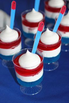 red, white and blue jello cups with toothpicks in them