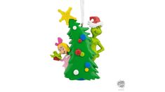 an ornament shaped like a christmas tree with the grin and elves hanging from it