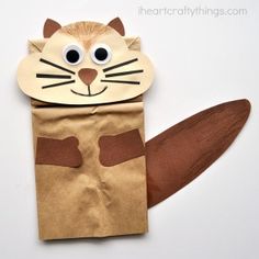 an animal made out of brown paper on top of a white background with the caption