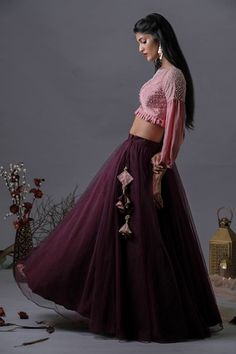 Purple lehenga in a solid base with tasselled side tie. Comes with pink frilled hem blouse embellished by pearls. - Aza Fashions Anarkali Designer Lehenga With Tassels, Festive Pink Sharara With Tassels, Designer Floor-length Sets With Tassels, Festive Pink Tassel Sharara, Designer Choli With Tassels For Festivals, Designer Festive Choli With Tassels, Designer Festival Choli With Tassels, Festive Sharara With Tassels For Reception, Traditional Wedding Dress With Back Tassel Tie-up