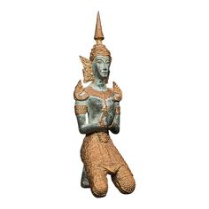 an ancient statue is shown against a white background