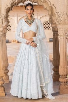 Ice blue lehenga with thread embroidered floral jaal patterns, embellished by mirrorwork. Comes with matching padded blouse and dupatta. - Aza Fashions Fitted V-neck Lehenga With Zari Work, Diwali V-neck Lehenga With Resham Embroidery, Festive V-neck Lehenga With Resham Embroidery, V-neck Lehenga With Mirror Work For Wedding, V-neck Wedding Choli With Mirror Work, V-neck Lehenga With Resham Embroidery For Diwali, V-neck Lehenga With Resham Embroidery For Wedding, Anarkali Lehenga With V-neck Fitted Style, Diwali Lehenga With Resham Embroidery And V-neck