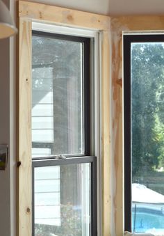 the inside of a house being built with wood framing and window sill in place