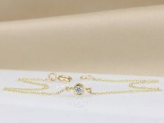 "Handmade by an inspired jewelry artist team with decades of experience in the craft of jewelry making. Each gemstone, each diamond is carefully picked. Using only the finest raw materials and the highest industry standard in manufacturing, design and finish. A beautiful dainty Diamond bracelet just for you. 14K yellow gold bracelet set with a single 2.5 mm Diamonds VS-E 0.5 ct √ Made in Solid 14K Gold, in your choice of color: Rose Gold, Yellow Gold, White Gold with Rhodium plating (see selecti Minimalist Round Gold Bracelet With Diamond Cut, Minimalist Gold Bracelet With Diamond Cut, Delicate Round Bracelets With Single Cut Diamonds, Minimalist Round Chain Bracelet With Diamond Cut, Dainty Round Diamond Bracelet With Diamond Cut, Minimalist 14k Gold Diamond Bracelet With Bezel Setting, Gold Diamond Bracelet With Single Diamond As Gift, Diamond Bracelet With Birthstone, Round Diamond Bracelet With Birthstone