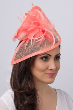 Stunning from every angle. This mesh twist fascinator has a look that’s both daring and elegant. This statement-making fascinator headband rises to the occasion with a twist mesh base, fluffy bouquet of flighty feathers all on an easy to wear headband with precision placement. This is a modern twist on the loved fascinator. - Light weight - Attached to headband for easy wear - Comes in several other bold colors Fluffy Bouquet, Fascinator Hats Outfit, Tea Bridal Shower, Tea Clothes, Kentucky Derby Fascinator, Happy Hat, Pink Fascinator, British Women, Fascinator Headband