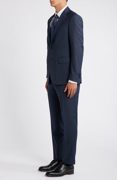 Navy wool brings polish and distinction to a suit that's tailored with traditional detailing and styled to make a versatile addition to any formal wardrobe. 31" length (size 54EU) Jacket has notched lapels; chest pocket; flap pockets; interior pockets; side vents Cuff buttons may not be attached. Jackets purchased at full price can have the sleeve length customized for free at your local Nordstrom Trousers have zip fly; slant pockets; back button-welt pockets Jacket is lined 100% wool Dry clean Slim Fit Three-piece Suit With Notch Lapel, Semi-formal Custom Fit Notch Lapel Suits, Semi-formal Custom Fit Suits With Notch Lapel, Semi-formal Notch Lapel Custom Fit Suits, Custom Fit Notch Lapel Suit For Semi-formal Occasions, Tailored Three-piece Suit For Semi-formal Occasions, Tailored Three-piece Suit For Semi-formal Events, Business Three-piece Suit With Single Button, Classic Blue Three-piece Suit With Hidden Button Closure