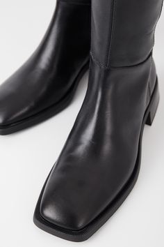 The Vagabond Blanca is the contemporary tall boots with a timeless design. The style is crafted in black leather featuring a knee-high shaft, subtle square toes and inside zippers. The thin rubber outsoles is complemented with 47mm flared block heels. Black leather Square toes 47mm flared heels Knee-high shaft Inside zippers For long-lasting care: use neutral shoe cream and protecting spray to ensure a longer lifespan for your shoes. Shaft height: 434 mmShaft width: 381 mmHeel height: 47 mm(base Womens Tall Black Boots, Block Heels Black, Black Tall Boots, Vagabond Shoes, Neutral Shoes, Cream Shoes, Black Boots Tall, Tall Boot, Heels Black