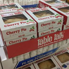 several boxes of cherry pie are stacked on top of each other