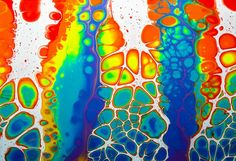 an abstract painting with multicolored lines and bubbles on it's surface,