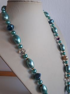 Vintage 50's blue glass faux pearl and crystal and blue coated lucite beaded necklace with clasp. 26 inches; glass faux pearl oval beads: 3/4 x 0.5 inches. Good vintage condition with some lost on the coating on the lucite beads -  - sold as is. Thank you for watching my other items! a large collection of vintage jewelry sets is listed and much more to come Combined shipping available where possible -please contact us for details before buying the items. Vintage Jewelry Sets, Oval Beads, Pearl Crystal, More To Come, Chain Styles, Blue Glass, Faux Pearl, Favorite Jewelry, Jewelry Sets