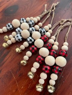 several wooden beads and bells on a table