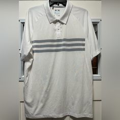 Adidas Climacool Golf Polo Three Stripe Design. Nwot. Has Two Small Snags On The Back (See Photo). White Breathable Polo Shirt For Sports Season, Breathable White Polo Shirt For Sports Season, White Breathable Short Sleeve Polo Shirt, Casual Three-stripes Golf Tops, Casual Three Stripes Tops For Golf, Casual Tops With Three Stripes For Golf, White Breathable Polo Shirt For Sports, Breathable White Polo Shirt For Sports, White Breathable Casual Polo Shirt