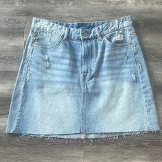 H&M High Waisted Denim Distressed Skirt. Size 8. Never Worn, New And With Tags! Summer Distressed Dark Wash Mini Skirt, Summer Dark Wash Distressed Mini Skirt, Light Wash Distressed Mini Denim Skirt, Distressed Denim Mini Skirt For Spring, Distressed Light Wash Mini Denim Skirt, Distressed Denim Skirt In Medium Wash, Summer Distressed Medium Wash Denim Skirt, Light Wash Denim Cutoff Mini Skirt, Ripped Denim Skirt In Medium Wash