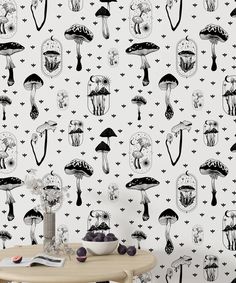 the wallpaper is decorated with black and white mushrooms