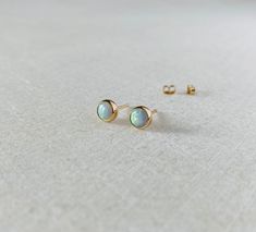 These solid 14k opal studs will be handmade to order.  Available in 4mm, 5mm and 6mm size.  Come with the tiny 14k gold ear backs.  The stones are man made, an imitation of white Australian opal. Solid gold sales are final, thank you! White Opal Earrings, Opal Stud Earrings, Stud Earrings Gold, Opal Earrings Stud, Opal Studs, Earrings White, Birthday Gift For Her, Opal Earrings, Australian Opal