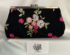 Your special occasion outfit will be complete, with this lovely black embroidered multicolored floral lace evening bag clutch purse handbag. The floral lace has flowers in various colors, such as fuchsia, peach, white, and red.  The leaves are sage.   Front and back views have different floral arrangements, as shown.  You may wish to use it as a clutch with no chain strap, as a purse with a 15.5" chain strap or shoulder bag with a 47.5" chain strap. This clutch is available with silver hardware. Elegant Rectangular Evening Bag For Spring, Elegant Rectangular Spring Evening Bag, Elegant Black Bags With Floral Print, Elegant Clutch For Spring Events, Elegant Spring Event Clutch, Elegant Spring Formal Evening Bag, Black Bags With Floral Embroidery For Spring, Embroidered Evening Bag For Summer, Rectangular Evening Bag For Spring Events