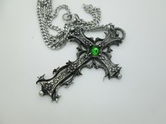 This Gothic cross necklace is an handmade pewter sculpture orned with an Austrian Swarovski or a real gem (My fav is the Black star Diopside, seriously) This gothic necklace is sold with a stainless steel chain of 18'' or 24'', if you would like to have a different length for the chain, you can write the desired length in the private note section when ordering :) This is a Gothic cross of 7cm This gothic cross necklace is a pewter sculpture of my own creation, i create and work the metal by myse Silver Cross Jewelry For Halloween, Gothic Cross Pendant Jewelry For Halloween, Halloween Silver Jewelry With Cross Pendant, Silver Cross Necklace For Halloween, Silver Cross Pendant Jewelry For Halloween, Gothic Cross Pendant Necklace With Engraving, Gothic Metal Cross Necklaces, Gothic Metal Cross Jewelry, Gothic Cross Metal Jewelry