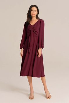 Radiate feminine charm in this dress. The delicate bow-knot detail adds a touch of sweetness, while the long sleeves provide a cozy and modest look. Perfect for any occasion, this midi dress effortlessly combines comfort and fashion.Material : 98%Polyester+2%ViscoseElasticity : NoneSku : CL2433A23*Package : 1*DressCare instructions:Do Not Bleach.Separate dark colors.Iron Low Heat. Chic Long Sleeve Dresses With Bow, Chic Long Sleeve Midi Dress With Bow, Long Sleeve Dress With Bow For Fall, Long Sleeve Fall Dress With Bow, Feminine Red Midi Dress For Fall, Fall Knee-length Dresses With Bow, Chic Midi Dress With Bow For Brunch, Red Long Sleeve Dress With Bow, Bodycon Floral Dress