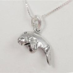 Sterling Silver Nautical Florida Manatee Baby Mammal Fish Pendant Necklace This Beautiful Nautical Florida Manatee Baby Mammal Fish .925 Sterling Silver Necklace Comes With A .925 Sterling Silver 20 Inch Chain And The Baby Florida Manatee.925 Sterling Silver Pendant. The Pendant Measures 3/8 Inches High And 5/8 Inches Wide. The Chain Measures 20 Inches And Weighs 2.2g. Cn 1-0274 Manatee Florida, Florida Baby, Gold Eagle Coins, Fish Pendant Necklace, Sterling Silver Charm Necklace, Fish Pendant, Gold Eagle, Nautical Jewelry, Valentines Necklace