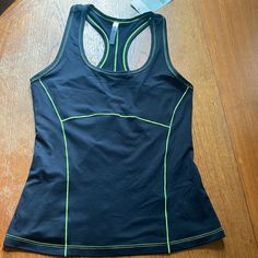 Nwt Fabletics Phoenix, Racerback Tank Size Small Black With Yellow Stitching. Anti-Microbial Fabric, Moisture Wicking Sporty Yellow Racerback Activewear, Yellow Fitted Tank Top For Sports, Yellow Sports Tank Top, Yellow Stretch Racerback Activewear, Yellow Racerback Activewear, Yellow Stretch Activewear With Light Support, Yellow Sleeveless Activewear For Sports, Yellow Sleeveless Sports Activewear, Yellow Stretch Go-dry Activewear