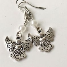 Silver Pearl Angel Wing Earrings Silver Plated Metal Alloy Glass White Pearls New Condition. White Dangle Alloy Earrings, White Alloy Dangle Earrings, White Alloy Drop Earrings, White Alloy Pierced Earrings, White Metal Earrings For Gift, White Alloy Jewelry With Matching Earrings, Angel Wings Earrings, Angels Wings, Wings Earrings