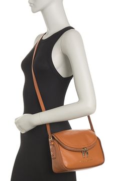 The perfect-sized miniature crossbody bag, crafted in supple leather with signature logo. . Single adjustable strap. Foldover flap with zip top closure. Approx. 7?H x 9.5?W x 3.5?D . Imported Leather exterior, textile lining Classic Everyday Saddle Bag, Leather Lined Saddle Satchel Bag, Leather Flap Bag With Detachable Strap, Tan Crossbody Flap Bag For Travel, Formal Soft Leather Saddle Bag, Fall Season Saddle Bag For Travel, Tan Crossbody Flap Bag With Adjustable Strap, Tan Flap Bag For Everyday Use, Leather-lined Saddle Bag For On-the-go