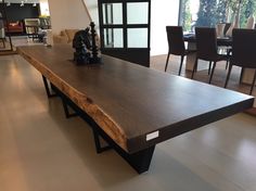 a large wooden table sitting in the middle of a room