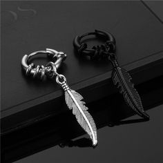 Material: Titanium Steel Color: Black (Single), Steel (Single) Fashion Element: Feather Style: Personality Black Minimalist Metal Cartilage Earrings, Trendy Black Metal Cartilage Earrings, Adjustable Black Metal Cartilage Earrings, Black Metal Cartilage Earrings, Black Punk Dangle Hoop Earrings, Black Dangle Hoop Earrings Punk Style, Black Dangle Hoop Earrings In Punk Style, Black Metal Dangle Cartilage Earrings, Black Dangle Cartilage Earrings