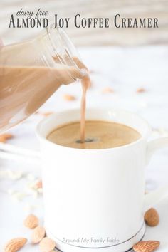 someone pouring coffee into a white cup with almonds around it and text overlay reading dairy free almond joy coffee creamer