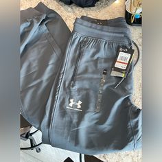 Brand New With Tags! Small Under Armor Joggers. Dark Grey! Under Armour Bottoms With Pockets, Under Armour Cotton Bottoms With Pockets, Under Armour Joggers, Under Armour Sweatpants, Track Pants Mens, Blue Joggers, Fleece Sweatpants, Printed Joggers, Under Armour Pants