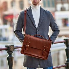 The leather briefcase bag from Wilderoe is not only a stylish accessory, but also a convenience for everyday life. This tan leather briefcase is designed to bring more comfort to your daily life. Spacious on the inside and minimalist on the outside. What could be more relevant and useful in a busy city life? For men and women, these messenger bag are not just a leather accessory, but a way to emphasize your individual style. Lightweight and elegant, each crossbody bag is the perfect complement to your look, holding your important items with ease. You can put your documents, books, laptop in it. Use it for work, meeting with friends or just to stand out in the crowd. Your urban style will be harmonious.  ❇️COMPARTMENTS: Front: There is one large convex pocket of 32*19 cm with metallic snaps Business Leather Backpack With Luggage Sleeve, Leather Shoulder Backpack With Luggage Sleeve For Business, Brown Business Laptop Bag Backpack, Brown Business Laptop Backpack, Brown Laptop Bag For Business, Brown Leather Backpack For Business With Luggage Sleeve, Brown Leather Business Backpack With Luggage Sleeve, Brown Business Briefcase Shoulder Bag, Cognac Satchel Briefcase With Luggage Sleeve