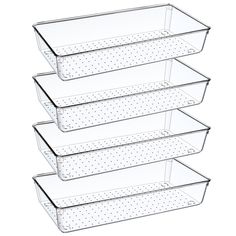 four clear plastic containers with polka dots on the bottom and bottom, each holding three trays