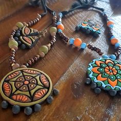 Very Nicely Crafted Artifacts Made With Mud & Bamboo. Beautiful Jewelry Made By Rural Women In Bangladesh. Artistic Hand Painted Brown Jewelry, Artistic Brown Jewelry For Festival, Artistic Jewelry For Jewelry Making And Festivals, Artistic Handmade Orange Jewelry, Terracotta Jewellery Designs, Rural Women, Pearl Lariat Necklace, Red Beaded Necklaces, Terracotta Jewellery